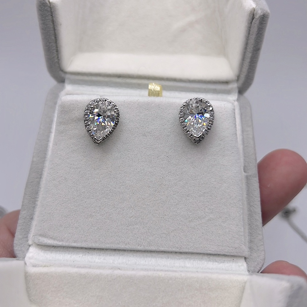 4.5 CARAT TW PEAR SHAPE WITH HALO LAB-GROWN MOSS. STUD EARRINGS IN 14K PLT925
